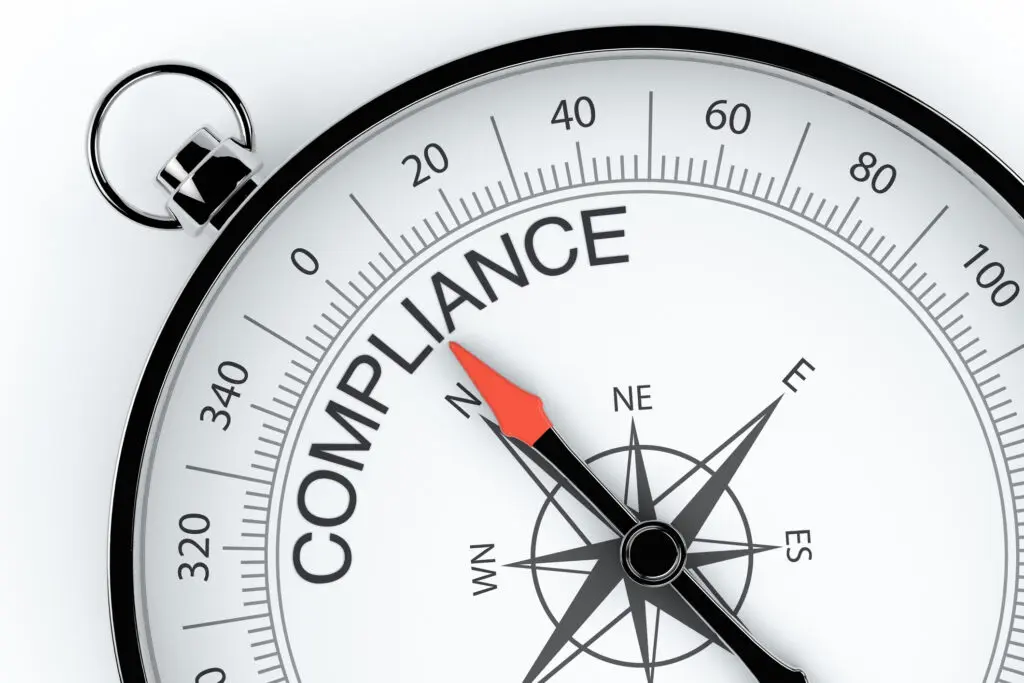 Compass needle pointing to compliance instead of directions.