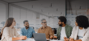 Team meeting with laptop in office setting.