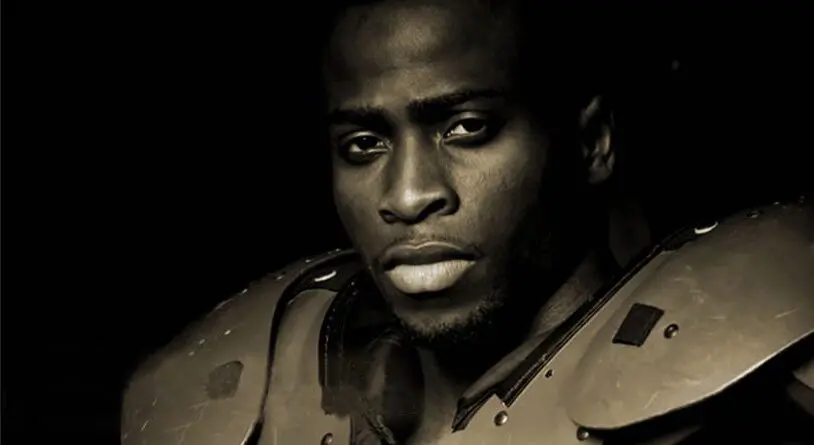 Close-up portrait of a serious man in armor.