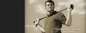 Man holding a golf club over his shoulder, looking confident.
